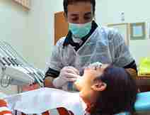 Dentist Providing Dental Treatment to Patient