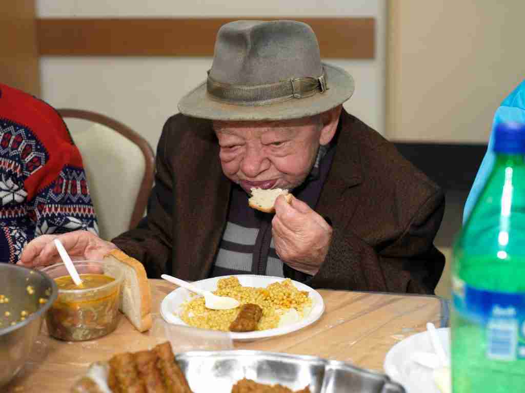 Man Enjoying a Seudas Aniyim Meal