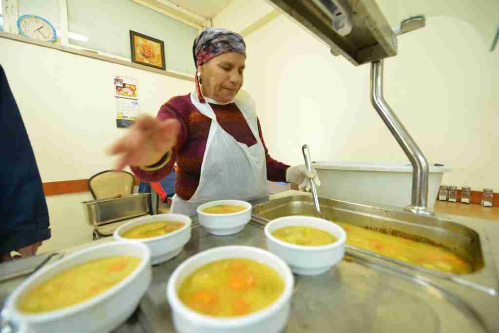 Woman Serving Seudas Aniyim Meals